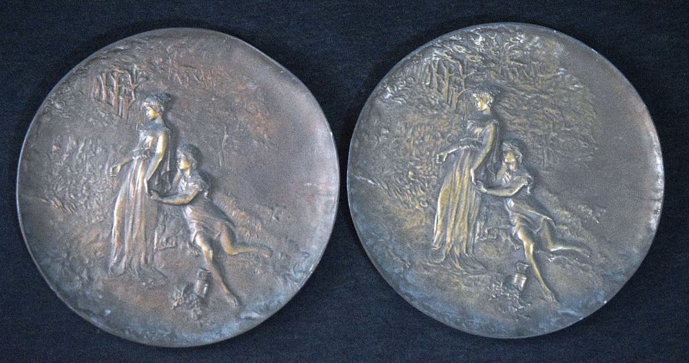 Early 20th C. Pair round cast metal relief plaques, 25cms