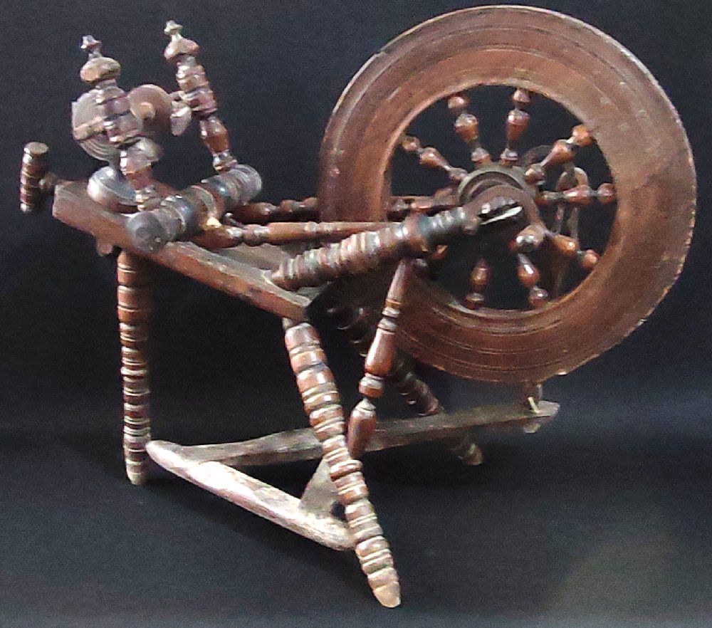 Early 19th C. oak spinning wheel, treadle type
