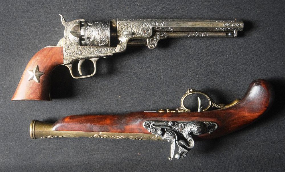 2 Imitation pistols (1 flintlock, 1 Revolver)