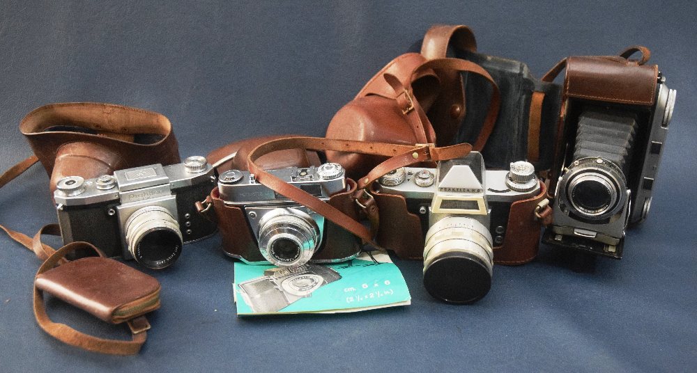 4 Old photo cameras with leather cases; 2 Practica, 1 Kodak & 1 Voigtlander