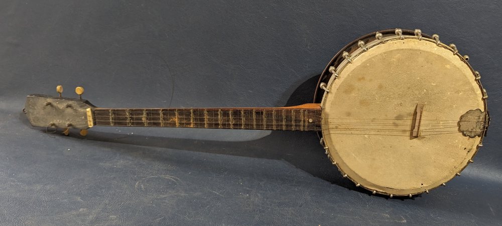 Banjo with metal and wood backing