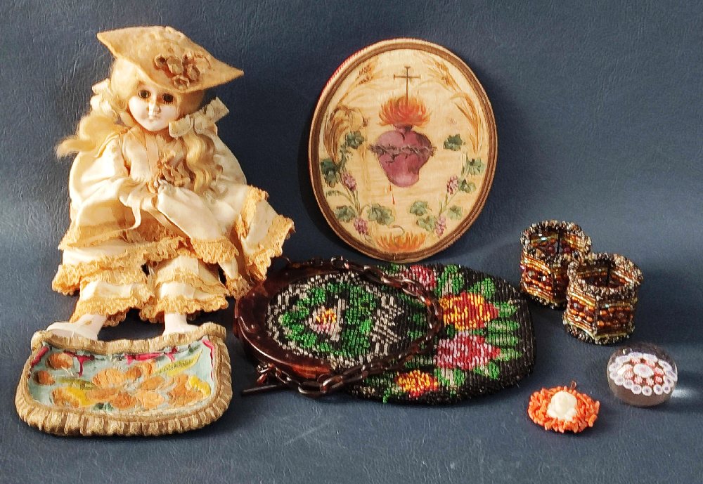 Early 20th C. doll, beaded purse and 2 napkin rings, coral pendent and paper weight