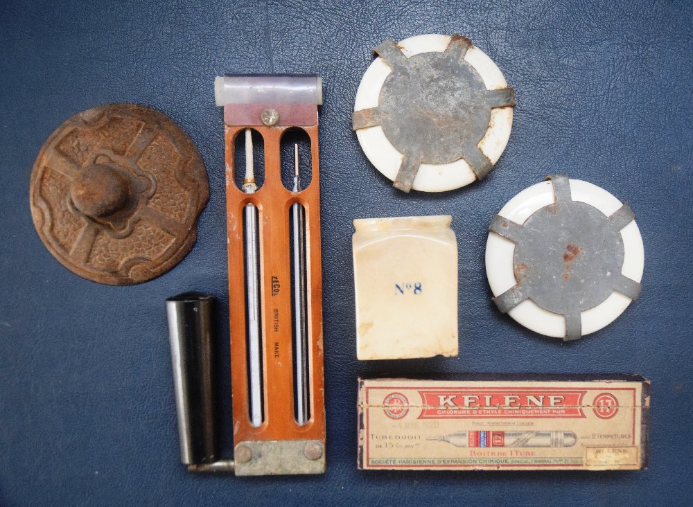 Thermometer, cast iron paperweight, 2 china military stoppers and ink bottle