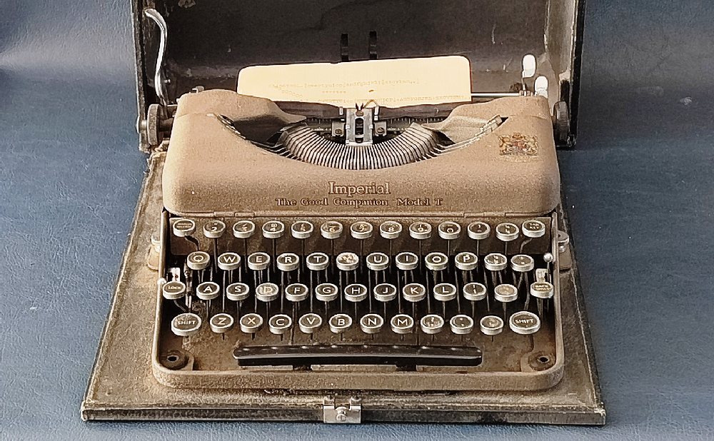 IMPERIAL Model T Portable typewriter in original carry case, ca. 1950s