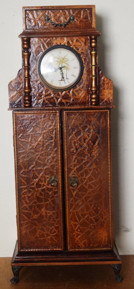 Lacquer CD cabinet with a clock, crocodile skin effect