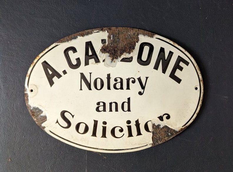 A. CA(LS?)ONE Notary and Solicitor, oval enamel sign, 31 x 22cm