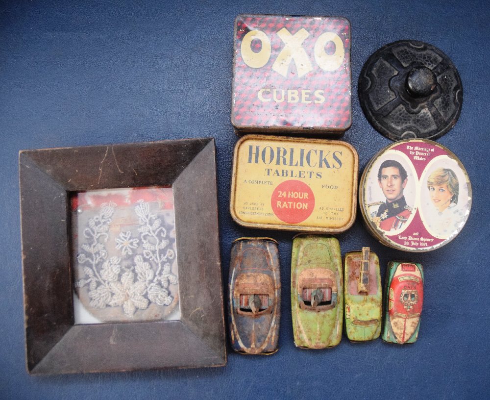 4, Early 20th C. tin toy cars, cast iron paper weight and 3 tin boxes