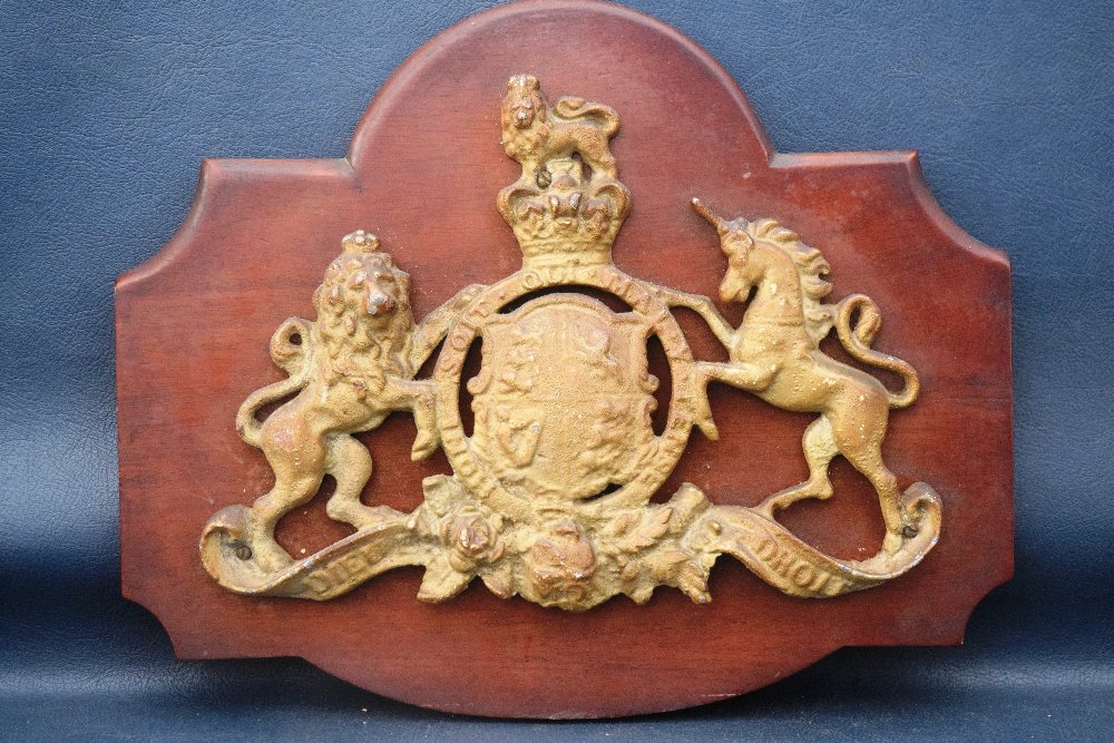 Cast brass Royal coat of arms, 29m, on wood plaque, 35cm