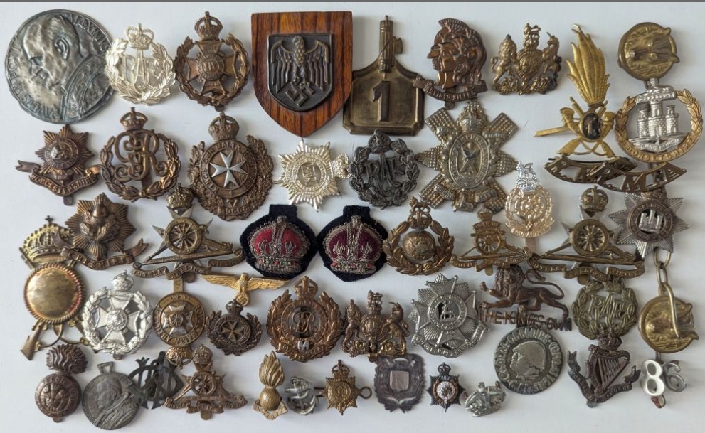 Collection of military badges and buttons